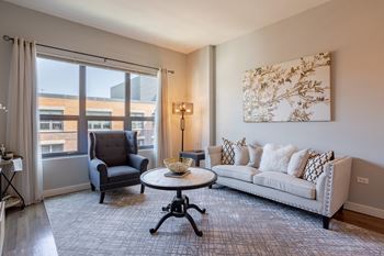 Living room with a couch and a chair and a window